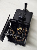 Pre-owned black steam locomotive model with open top, visible valves and pipes