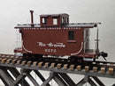 Brown model caboose with Denver & Rio Grande Western lettering, windows, and handrails