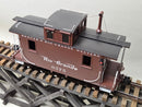 Brown model caboose with Rio Grande 0575, black roof panels, and ladder on end