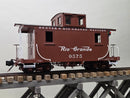 Brown model caboose with Denver & Rio Grande Western lettering, windows, and black roof