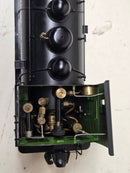 Pre-owned model steam locomotive, open cab showing black cylinders and controls.