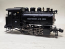 Pre-owned model steam locomotive, side view with tender, wheels, and number 97.